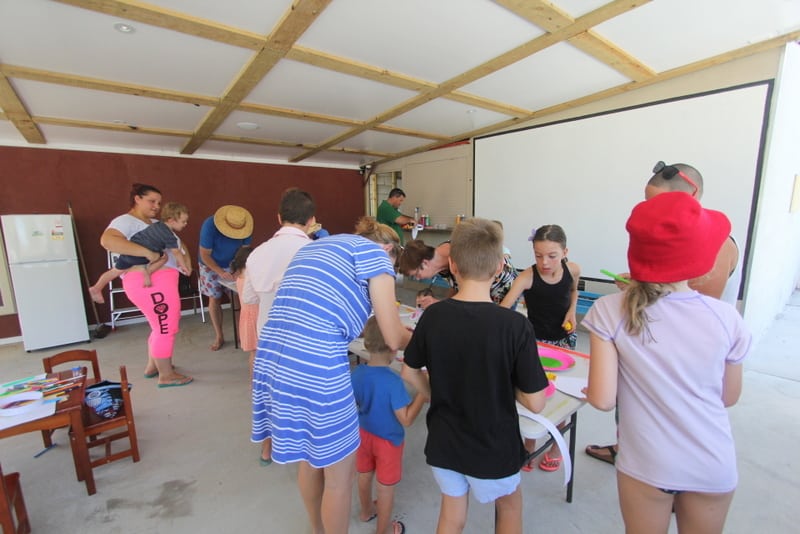 Parents And Children Doing Art — Caravan Park in Kinka Beach, QLD
