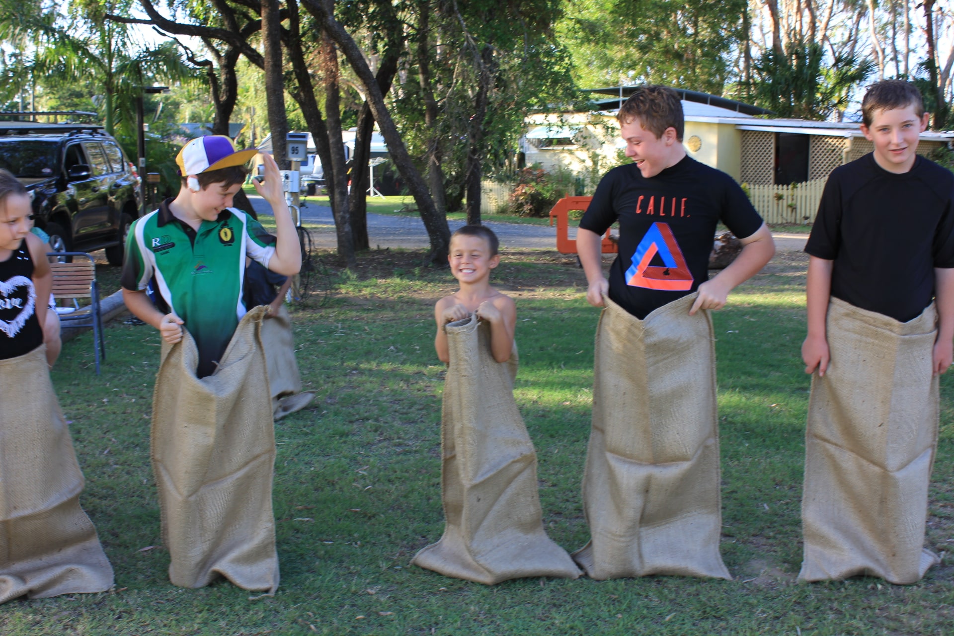 Kids Playing Sack Race 3 — Caravan Park in Kinka Beach, QLD