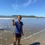 Kid WIth a Caught Fish — Caravan Park in Kinka Beach, QLD