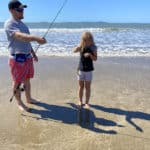 Girl holding fish she caught — Caravan Park in Kinka Beach, QLD