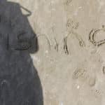 'Fishing' Written in Sand — Caravan Park in Kinka Beach, QLD