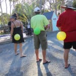 Adults playing game with balloons — Caravan Park in Kinka Beach, QLD