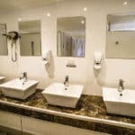 Bathroom with 4 sinks — Caravan Park in Kinka Beach, QLD